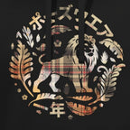 Close-up of a black hoodie featuring a large front graphic with a lion, ornate leaves, Japanese text, and a plaid pattern in beige, gold, and muted red tones.