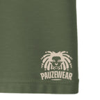 Green fabric with a white logo and text 'PAUZEWEAR' on a white background