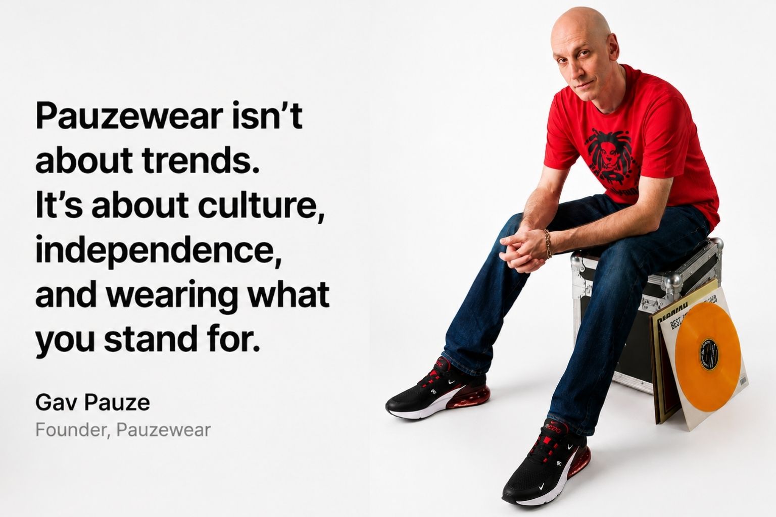 Man sitting on a stool with vinyl records, wearing a red t-shirt and black shoes, with a quote about Pauzewear's values.