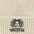 Beige knitted fabric with a black logo and 'PAUZEWEAR' text