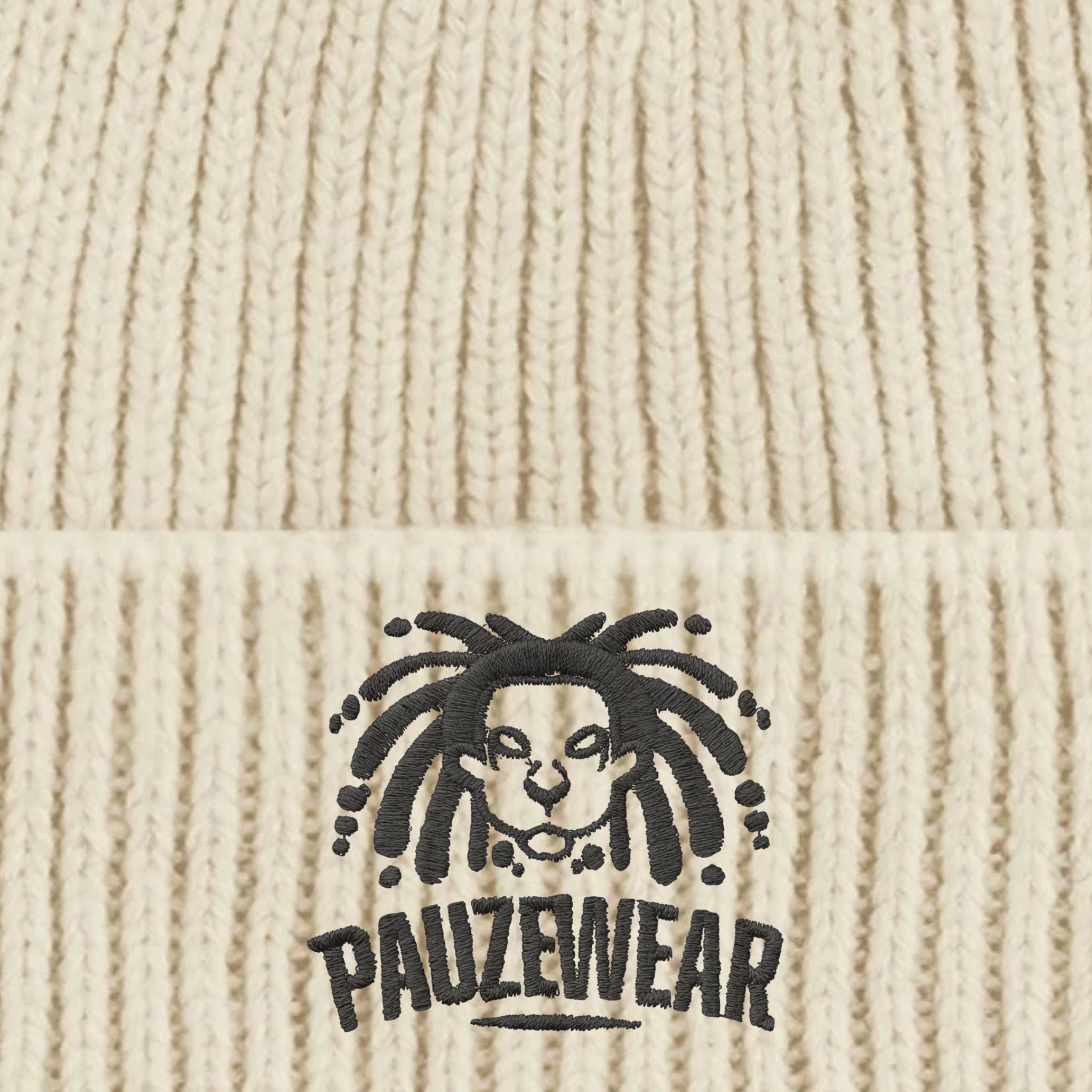 Beige knitted fabric with a black logo and 'PAUZEWEAR' text