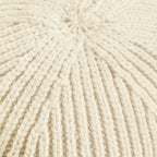 Close-up of beige yarn with a textured pattern