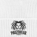 Close-up of a white beanie with a black logo and text on a textured white background
