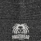 Close-up of a textured reflective black fabric with a white logo and text.