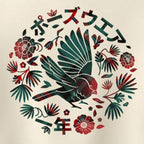 A circular graphic print featuring a stylised bird in dark teal and red with Japanese text above and below, surrounded by red flowers and green leaves on a cream background.