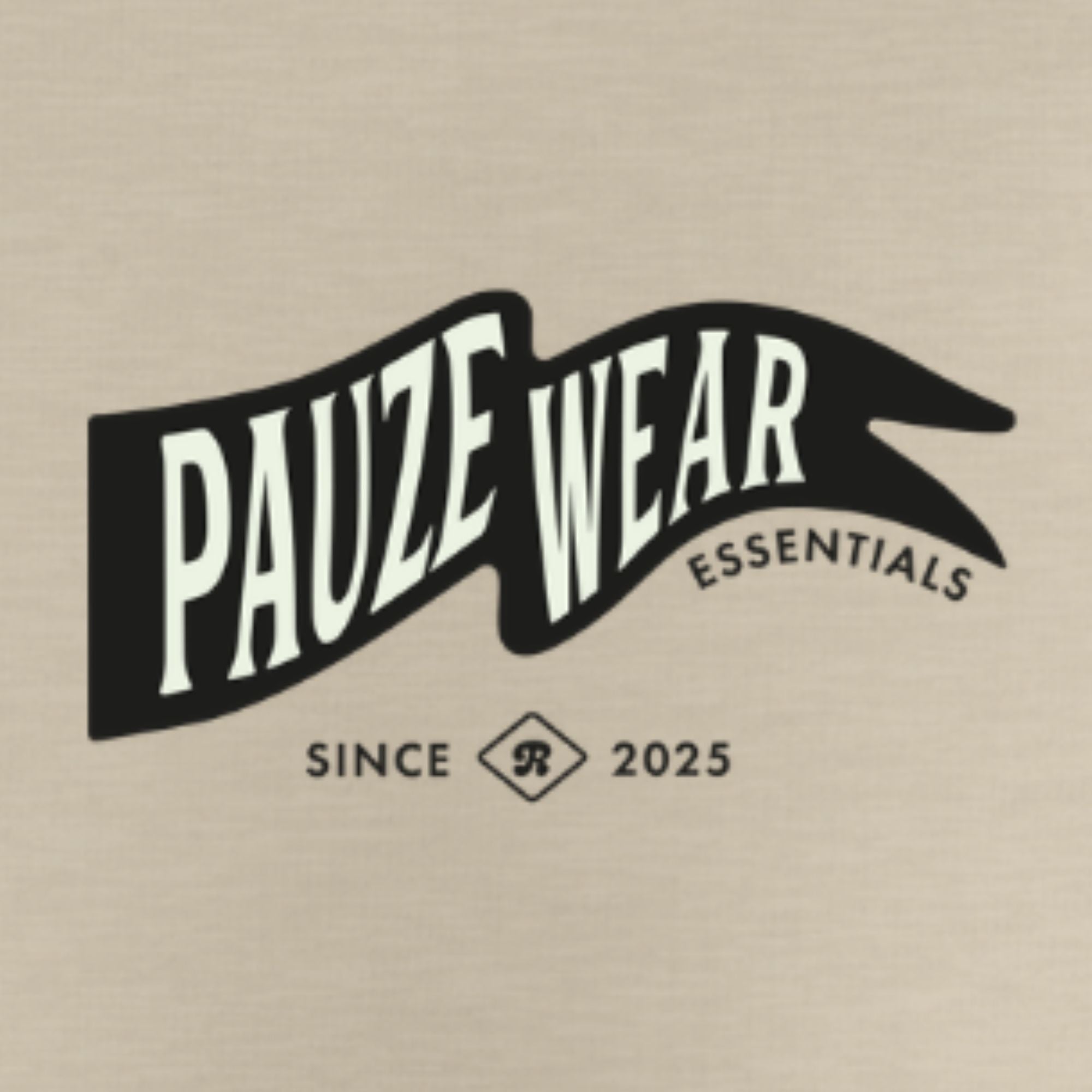 A beige fabric surface with a black and white graphic print reading 'PAUZE WEAR ESSENTIALS' and 'SINCE 2025' below it.